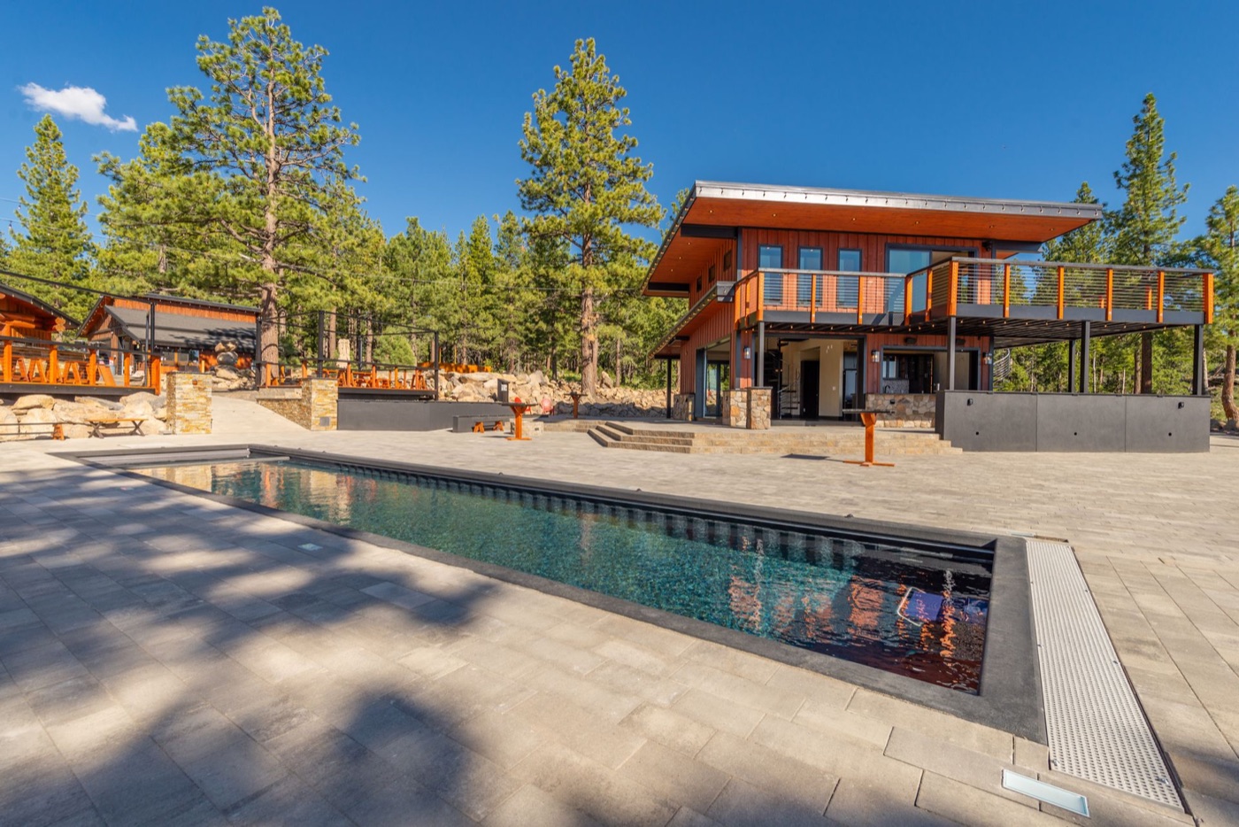 Austin Ridge marketing photo showing the pool, patio, and venue buildings.