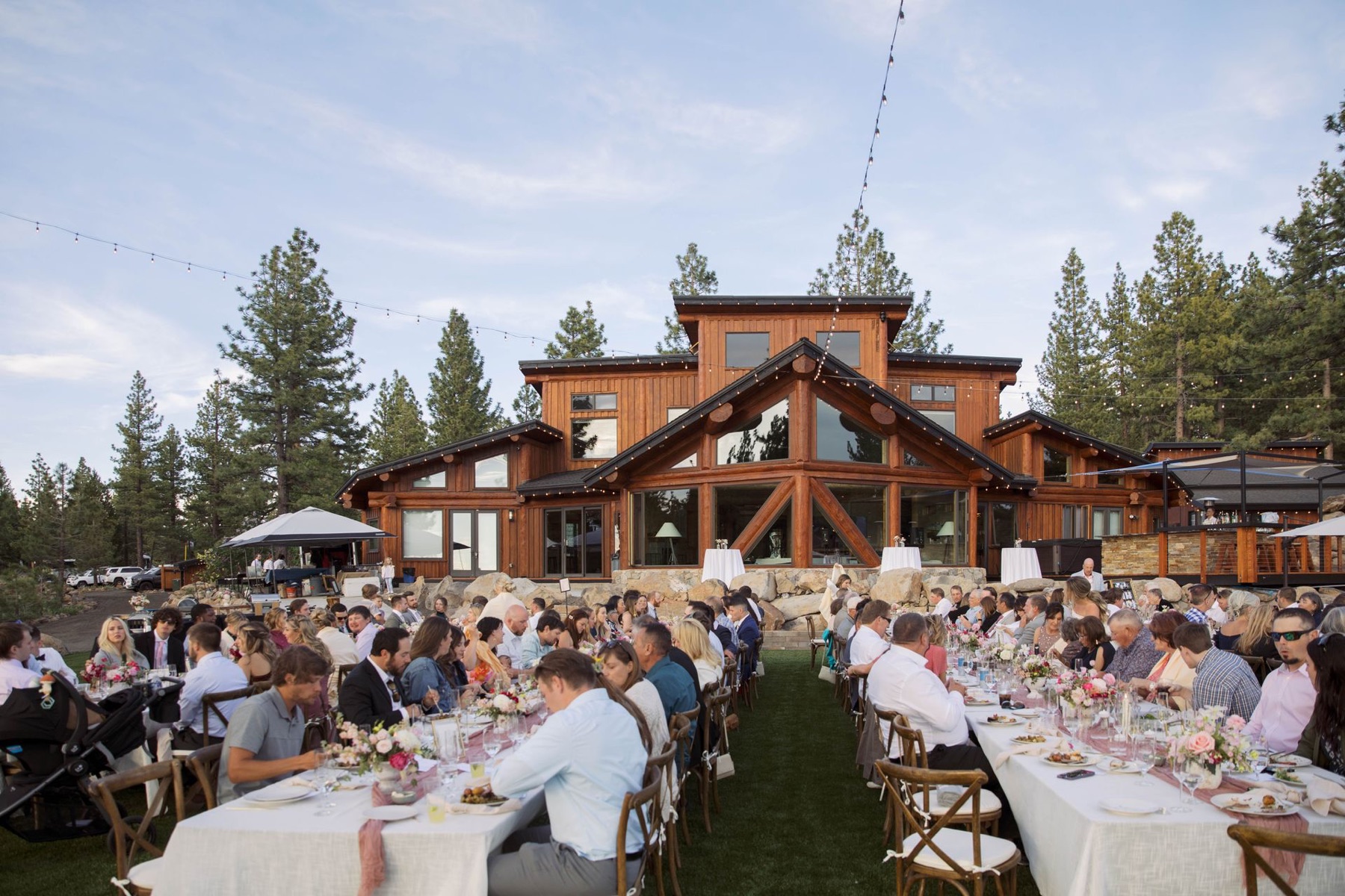 Austin Ridge marketing photo showing a large outdoor wedding reception in front of the venue.